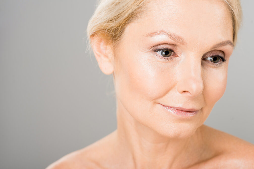 Attractive,And,Blonde,Mature,Woman,Looking,Away,On,Isolated,On